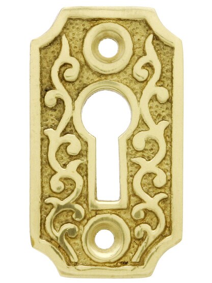 Solid Brass Scroll Keyhole Cover in Polished Brass.